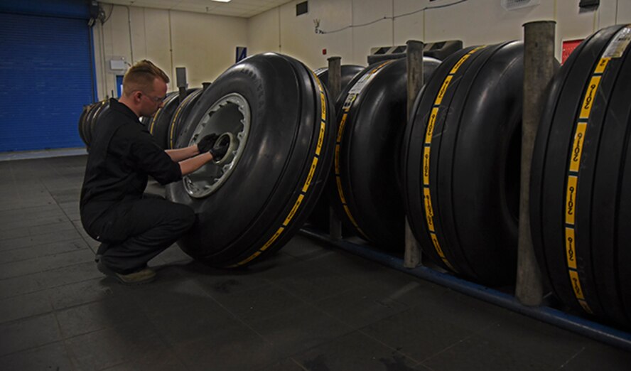 Airman 1st Class Cody Mathews, 92nd Maintenance Squadron aerospace repair journeyman, completes a tire build at Fairchild Air Force Base July 22, 2016. The aerospace repair shop specializes in tasks such as aircraft flight controls, landing gear components, wheel and tire repair and Crash, Damaged/Disabled Aircraft Recovery. (U.S. Air Force photo/Airman 1st Class Mackenzie Richardson)