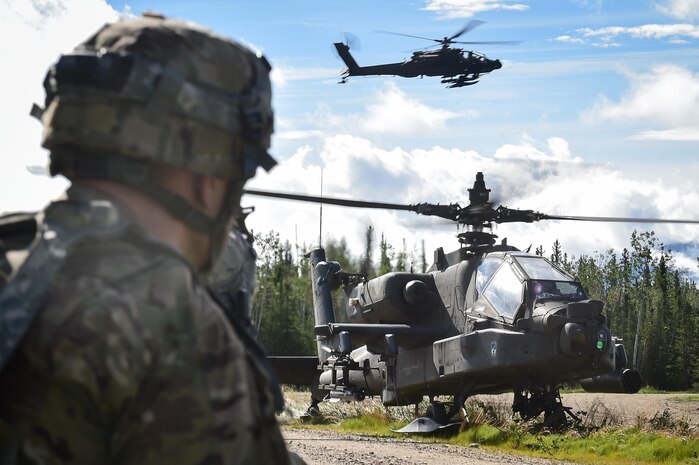 An AH-64 Apache attack helicopter lands on a road near defensive positions held by A Company, 1st Battalion, 24th Infantry Regiment, 1st Stryker Brigade Combat Team, 25th Infantry Division, U.S. Army Alaska, during a coordinated Opposing Forces attack in Donnelly Training Area near Ft. Greely, Alaska in the Arctic Anvil exercise, Monday, July 25, 2016. Arctic Anvil is a joint, multinational exercise which includes forces from USARAK’s 1st Stryker Brigade Combat Team, 25th Infantry Division and UATF, along with forces from the 196th Infantry Brigade’s Joint Pacific Multinational Readiness Capability, the Iowa National Guard’s 133rd Infantry Regiment and the 1st Battalion, Princess Patricia’s Canadian Light Infantry. (U.S. Air Force photo/Justin Connaher)