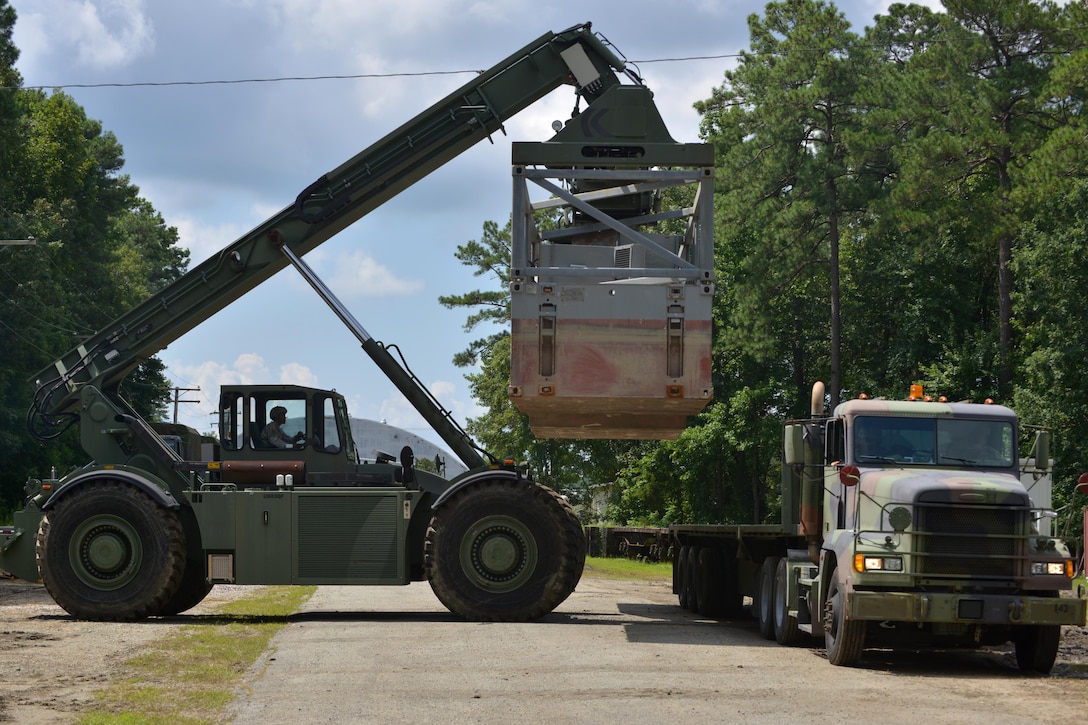 U.S. Army 7th Transportation Brigade (Expeditionary) Soldiers, move containers using a rough terrain container handler during a cargo-load training at Fort Eustis, Va., July 20, 2016. The 7th TB(X) is a direct reporting unit to the XVIII Airborne Corps and maintains a critical link to its strategic partners across the U.S. Transportation Command, the combatant commands, the Army Materiel Command, and its total force maritime partners. (U.S. Air Force photo by Staff Sgt. Natasha Stannard)