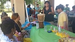 Several employees from DLA Aviation at Jacksonville, Florida participated in the 8th annual Multicultural Fun Day July 14, 2016 at Naval Air Station Jacksonville. The group represented Hawaiian culture and set up a display with traditional Hawaiian history, musical instruments and food.  