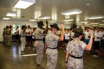 Seven Drill Instructors from Marine Corps Recruit Depot Parris Island, S.C., and San Diego, Calif., recite the Drill Instructor Creed before the commencing of Recruiting Station Lansing, Mich., Mini Boot Camp, July 15, 2016.  Mini Boot Camp serves to better prepare Marine Corps Poolees for the rigors of recruit training.