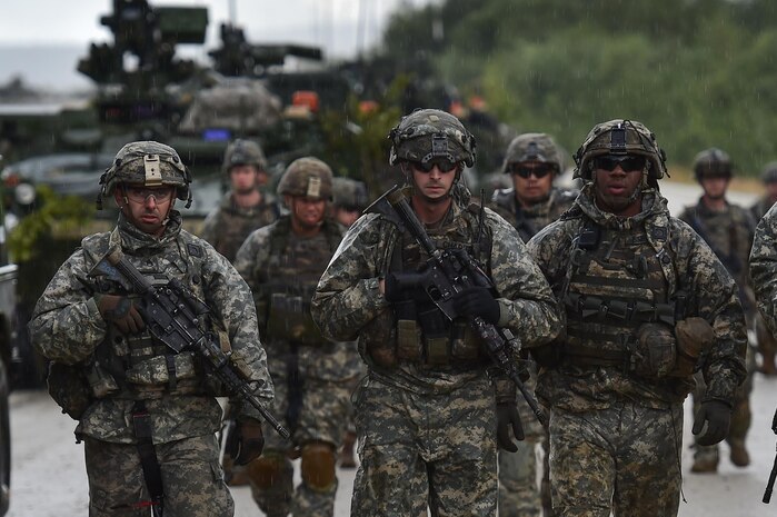 Soldiers assigned to 1st Battalion, 5th Infantry Regiment, 1st Stryker Brigade Combat Team, 25th Infantry Division, U.S. Army Alaska, walk in the rain in the Yukon Training Area near Fort Wainwright, Alaska, before a company live-five during the Arctic Anvil 2016 exercise, Saturday, July 23, 2016. Arctic Anvil is a joint, multinational exercise which includes forces from USARAK’s 1st Stryker Brigade Combat Team, 25th Infantry Division and UATF, along with forces from the 196th Infantry Brigade’s Joint Pacific Multinational Readiness Capability, the Iowa National Guard’s 133rd Infantry Regiment and the 1st Battalion, Princess Patricia’s Canadian Light Infantry. (U.S. Air Force photo/Justin Connaher)