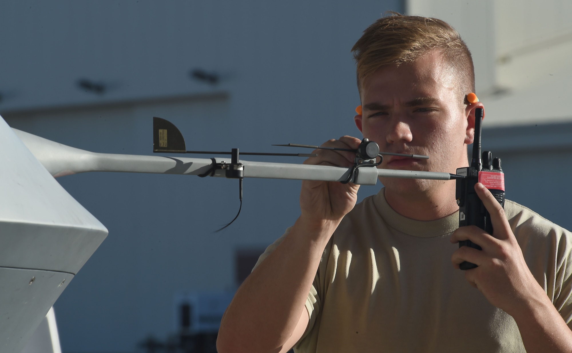 Airman 1st Class Conner, a crew chief assigned to 432nd Aircraft Maintenance Squadron, performs a pre-flight check on an MQ-9 Reaper before its departure to support Red Flag 16-3 July 19, 2016, at Creech Air Force Base, Nevada. The exercise consists of realistic training scenarios that prepare aircrews for future combat operations. (U.S. Air Force photo by Airman 1st Class James Thompson/Released)