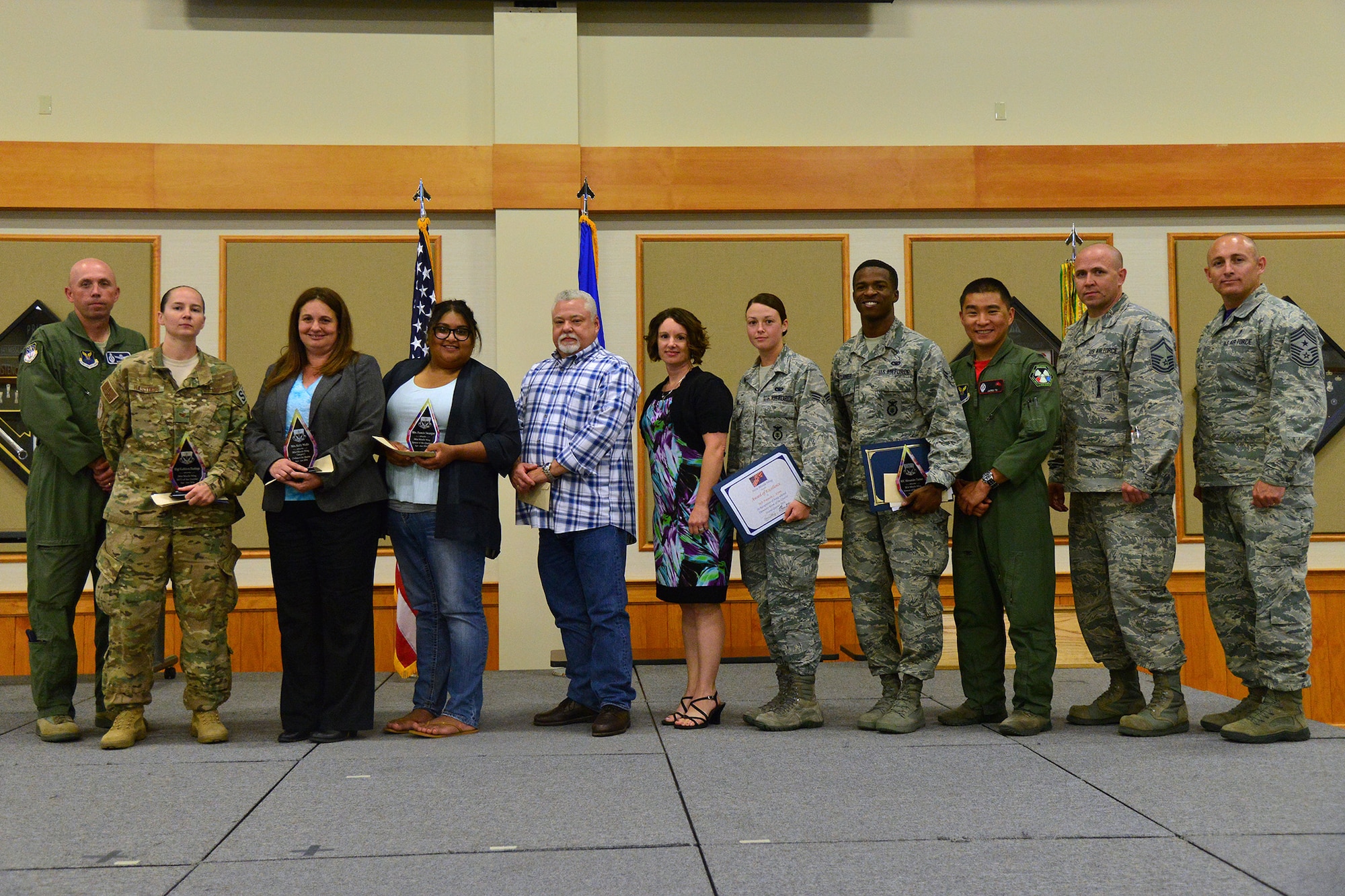 Winners of the 2nd Quarter Wing Quarterly Awards pose for a photo at the Grizzly Bend July 22, 2016. Pictured from left to right are: Col. Ron Allen, 341st Missile Wing commander; NCO of the Quarter, Staff Sgt. Kathleen Hastings, 341st Security Forces Group; Civilian Category I, Kelly Wolfe, 341st Medical Group; Spouse of the Quarter, Francis Swanger, 341st Mission Support Group; Civilian Category II, Mark Hewitt, 341st MDG; Civilian Category II Supervisory, Keri Adorisio, 341st MSG; Dormitory Room of the Quarter, Senior Airman Amanda Lynn, 341st Security Support Squadron; Airman of the Quarter, Airman 1st Class Alexander Turner, 341st SFG; Company Grade Officer of the Quarter, 1st Lt. James To, 341st Operations Group; Senior NCO of the Quarter, Senior Master Sgt. Brian Newbraugh, 341st Maintenance Group; Chief Master Sgt. Thomas Stiles, 341st MW command chief. Not pictured: Civilian Category I Supervisory, Joseph Beard, 341st MSG; 341st MW Professional Team of the Quarter, Bioenvironmental Engineering Flight, 341st MDG; Honor Guard of the Quarter, Airman 1st Class Dylan Taylor, 341st MXG; Volunteer of the Quarter, Tech. Sgt. Traci England, 341st MDG. (U.S. Air Force photo/Airman 1st Class Daniel Brosam)