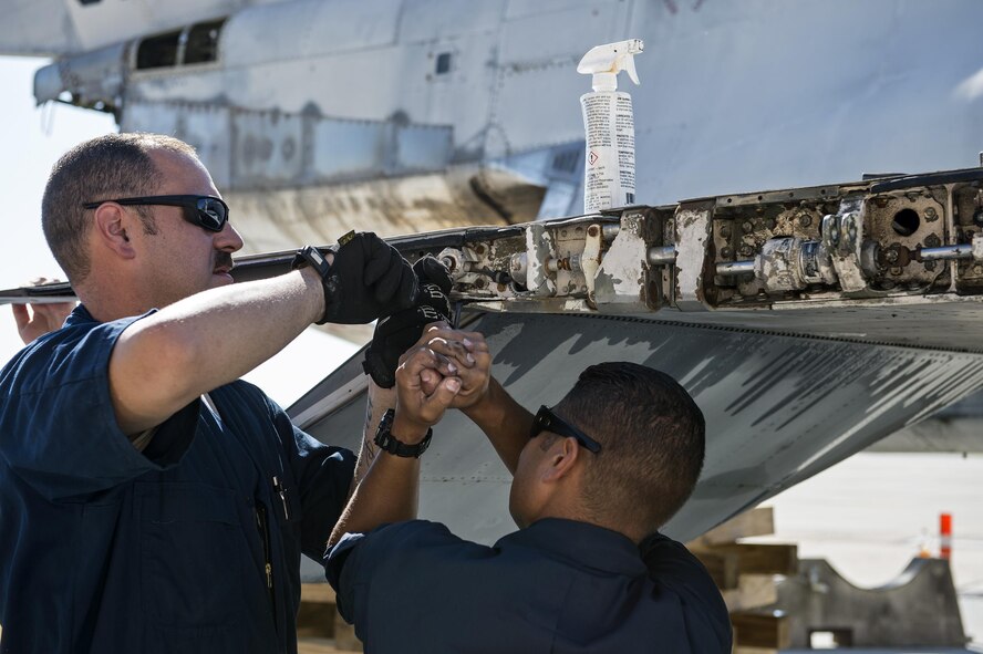 U.S. Air Force Tech. Sgt. Thomas Breining, left, and Tech. Sgt. Guillermo Rodriguez-Baez, 23d Equipment Maintenance Squadron crashed, damaged and disabled aircraft recovery team chiefs, take a panel off of an F-4 Phantom II, July 25, 2016, at Moody Air Force Base, Ga. The F-4 came to Moody with the F-86 Sabre that is currently on display in the George W. Bush Air Park, but was not added to the collection because it was never flown by the Flying Tigers. (U.S. Air Force photo by Airman 1st Class Janiqua P. Robinson)