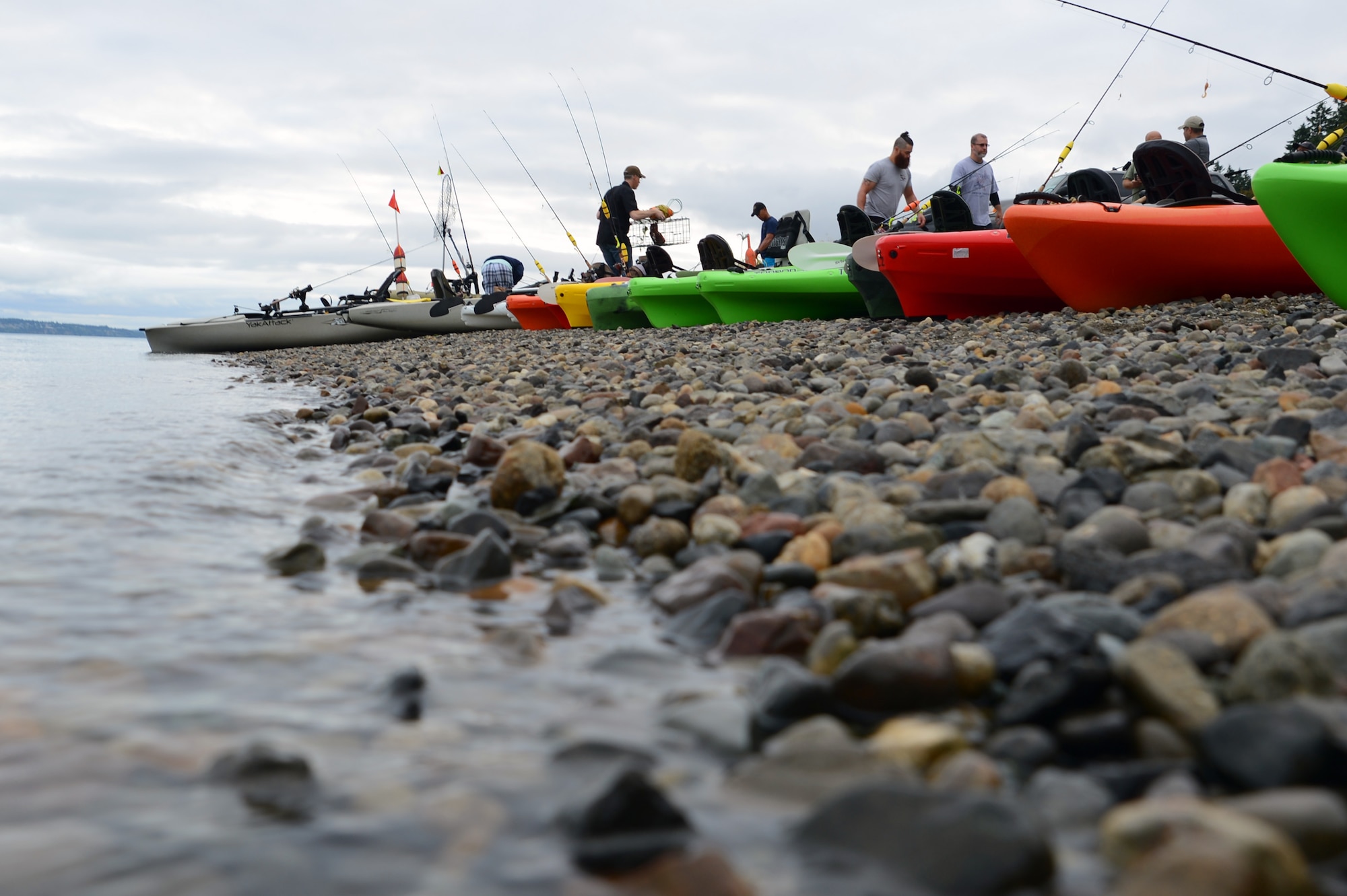 Heroes on the Water participants prepare their kayaks for a day of fishing July 23, 2016, at Solo Point Joint Base Lewis-McChord, Wash. More than 30 participants and volunteers took to the water to fish and crab at the event. (U.S. Air Force photo/Senior Airman Jacob Jimenez)   