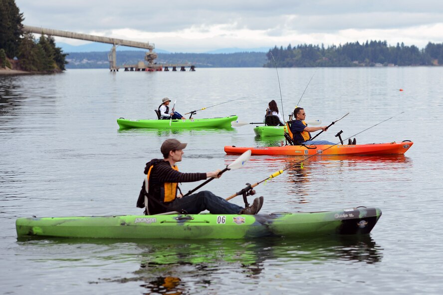 Heroes on the Water participants kayak together July 23, 2016, at Solo Point Joint Base Lewis-McChord, Wash. Heroes on the Water is a nonprofit organization dedicated to helping military members and veterans by providing a therapeutic experiences through kayak fishing. (U.S. Air Force photo/Senior Airman Jacob Jimenez) 