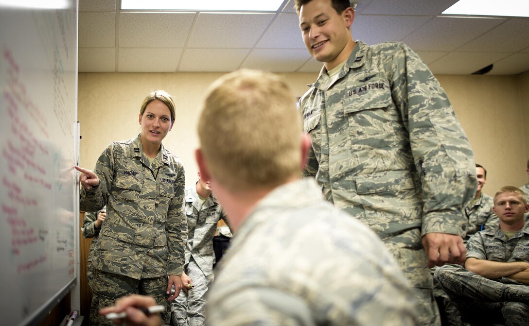 Space and Cyber Airmen discuss operations Friday, July 22, 2016, at Nellis Air Force Base, Nevada, during Red Flag 16-3. Red Flag 16-3 is aimed at teaching service members how to intergrate air, space and cyberspace elements. (U.S. Air Force photo/Tech. Sgt. David Salanitri) 