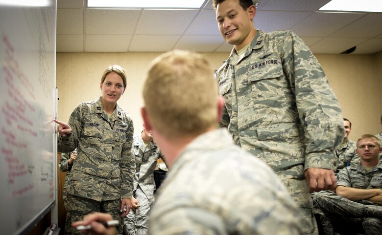 Space and Cyber Airmen discuss operations Friday, July 22, 2016, at Nellis Air Force Base, Nevada, during Red Flag 16-3. Red Flag 16-3 is aimed at teaching service members how to intergrate air, space and cyberspace elements. (U.S. Air Force photo/Tech. Sgt. David Salanitri) 