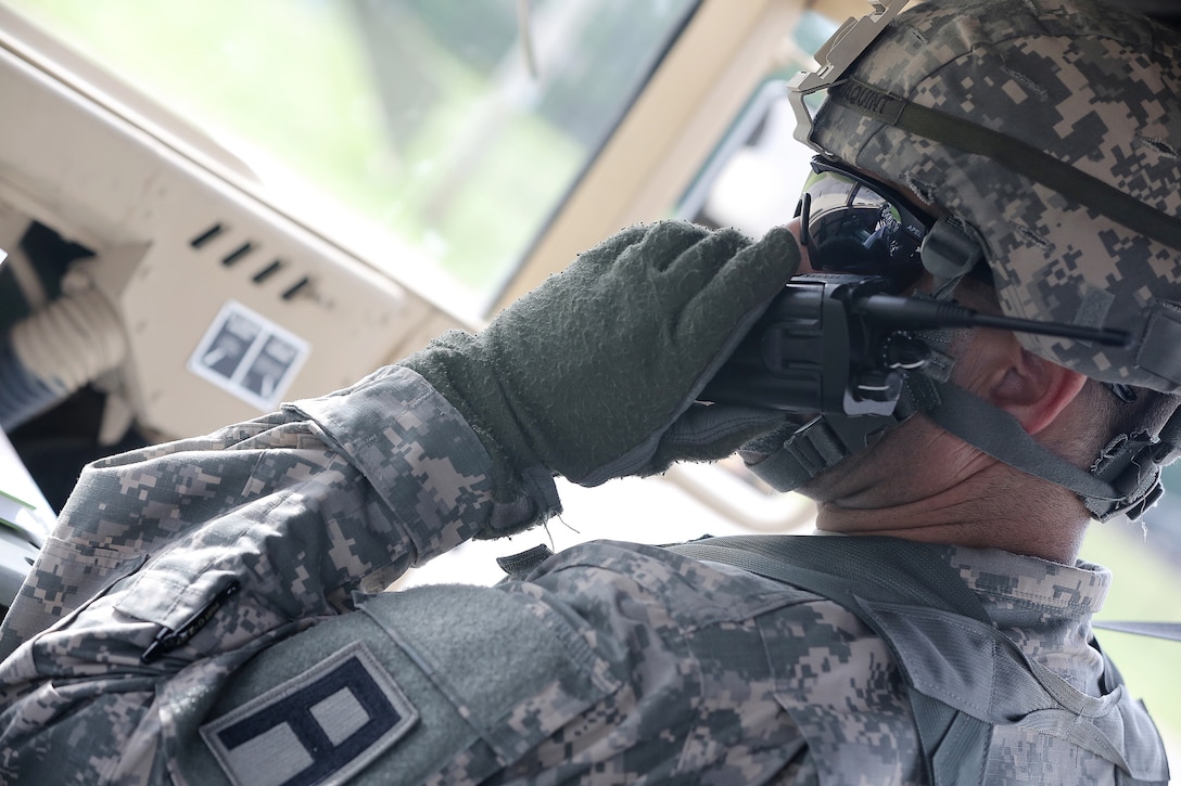 Lt. Col. Daniel Jaquint, battalion commander of the 1st Battalion, 383rd Regiment, 181st Infantry Brigade, contacts forward operating (training) base Liberty, Fort McCoy, Wisconsin, prior to arrival there with Col. Robert Cooley, deputy commander for the 85th Support Command, July 11, 2016.
(U.S. Army photo by Mr. Anthony L. Taylor/Released)