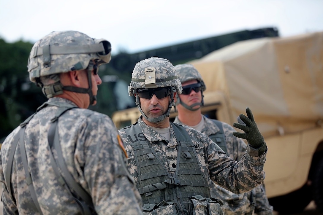 Lt. Col. Daniel Jaquint, battalion commander of the 1st Battalion, 383rd Regiment, 181st Infantry Brigade, briefs Col. Robert Cooley, deputy commander for the 85th Support Command, about 1-383 operations at Warrior Exercise 86-16-03 during a visit to forward operating (training) base Liberty, Fort McCoy, Wisconsin, July 11, 2016.
(U.S. Army photo by Mr. Anthony L. Taylor/Released)