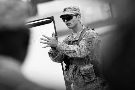 Capt. Devon Stanforth, observer-coach/trainer assigned to the 1st Battalion, 383rd Regiment, 181st Infantry Brigade, conducts a class on troop leading procedures to soldiers assigned to the 314th Chemical Company, Decatur, Georgia, at forward operating (training) base Liberty, Fort McCoy, Wisconsin, July 11, 2016.
(U.S. Army photo by Mr. Anthony L. Taylor/Released)