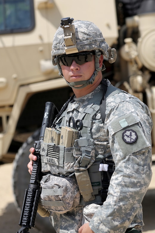 A soldier assigned to the 320th Military Police Company, Saint Petersburg, Florida, pauses for a photo at tactical training base Patriot, Fort McCoy, Wisconsin, during Warrior Exercise 86-16-03, July 11, 2016. The soldiers assigned to TTB Patriot primarily train in convoy security, checkpoint procedures, and escort missions.
(U.S. Army photo by Mr. Anthony L. Taylor/Released)