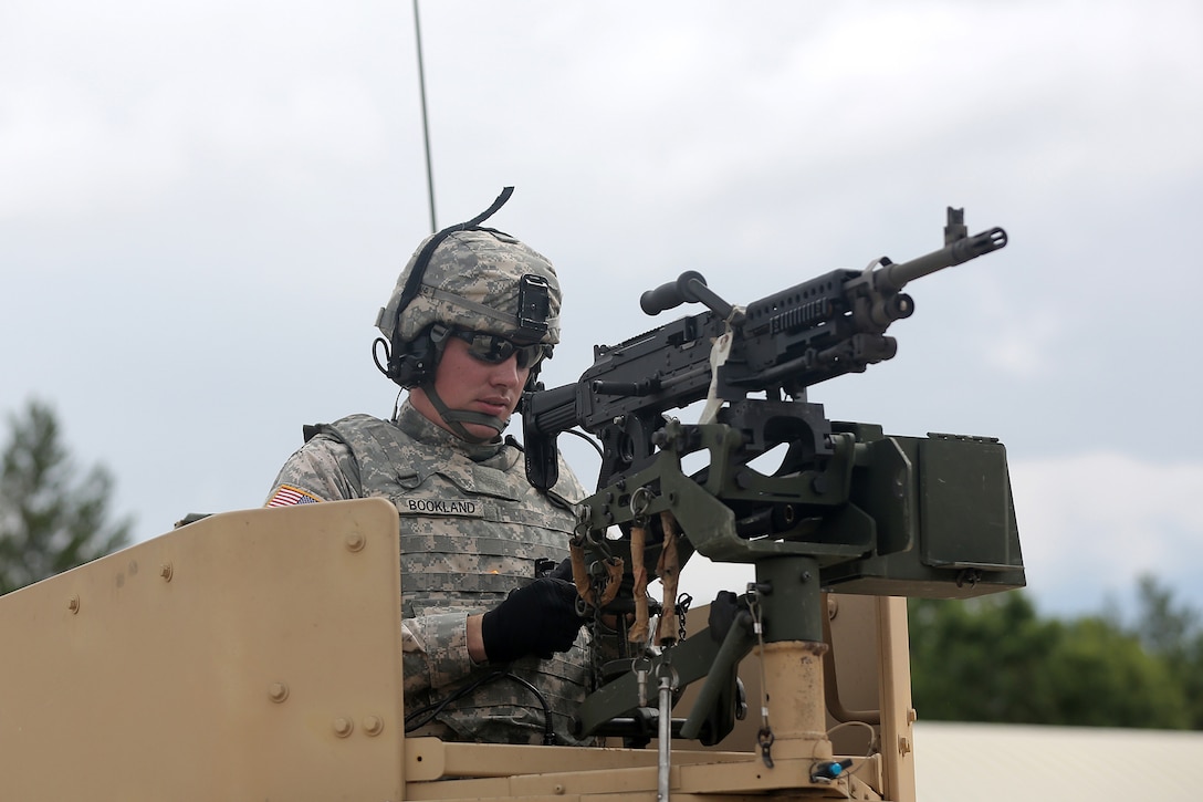 Spc. Jeremy Bookland, Information Technology Specialist assigned to the 206th Regional Support Group, Springfield, Illinois, stands in his Humvee weapon mount after returning from the live-fire proof of principle training, July 12, 2016, at Warrior Exercise 86-16-03, Fort McCoy, Wisconsin.
(U.S. Army photo by Mr. Anthony L. Taylor/Released)