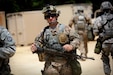A soldier assigned to the 320th Military Police Company, Saint Petersburg, Florida, walks through tactical training base Patriot, Fort McCoy, Wisconsin, during Warrior Exercise 86-16-03, July 11, 2016. The soldiers assigned to TTB Patriot primarily train in convoy security, checkpoint procedures, and escort missions.
(U.S. Army photo by Mr. Anthony L. Taylor/Released)