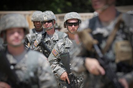 Army Reserve soldiers assigned to the 320th Military Police Company, walk through tactical training base Patriot, Fort McCoy, Wisconsin, during Warrior Exercise 86-16-03, July 11, 2016. The WAREX lasted 20 days with active and reserve component soldiers preparing reserve and guard soldiers for training and deployment in the Army Force Generation Model.
(Photo by Sgt. First Class Anthony Taylor)