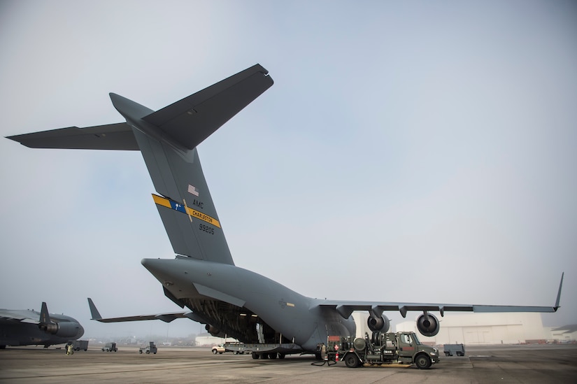 An R12 refueling vehicle fuels a C-17 Globemaster III on the flightline July 18, 2016, at Joint Base Charleston, S.C. Last year, over 50 Airmen of the 628th LRS fuels flight provided the base with more than 36 million gallons of fuel for missions throughout the base. (U.S. Air Force photo/Staff Sgt. Jared Trimarchi)