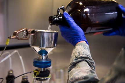 Senior Airman Wesley Watkins checks for contaminants in jet fuel inside the 628th Logistic Readiness Squadron fuels laboratory, July 11, 2016 at Joint Base Charleston, S.C. Last year, over 50 Airmen of the 628th Logistics Readiness Squadron fuels flight provided the base with more than 36 million gallons of fuel for missions throughout the base. (U.S. Air Force photo/Staff Sgt. Jared Trimarchi) 