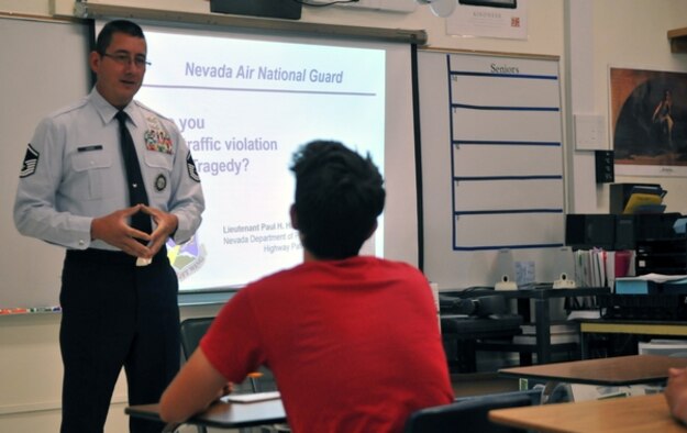 Master Sgt. Paul Hinen, Nevada Air National Guard recruiting and retention manager, presents a traffic safety course at Reno High on July 14. Photo by Tech. Sgt. Emerson Marcus