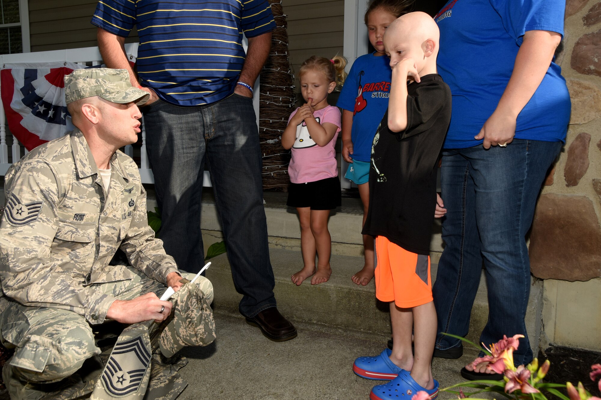 178th Wing member Tech. Sgt. Dallas Root, along with 15 other wing members, present Barrett Fitzsimmons with an honorary Chief Master Sgt. uniform June 26, at his home in Springfield Ohio. 
Fitzsimmons was recently diagnosed with stage four Hepatocellular Carcinoma.