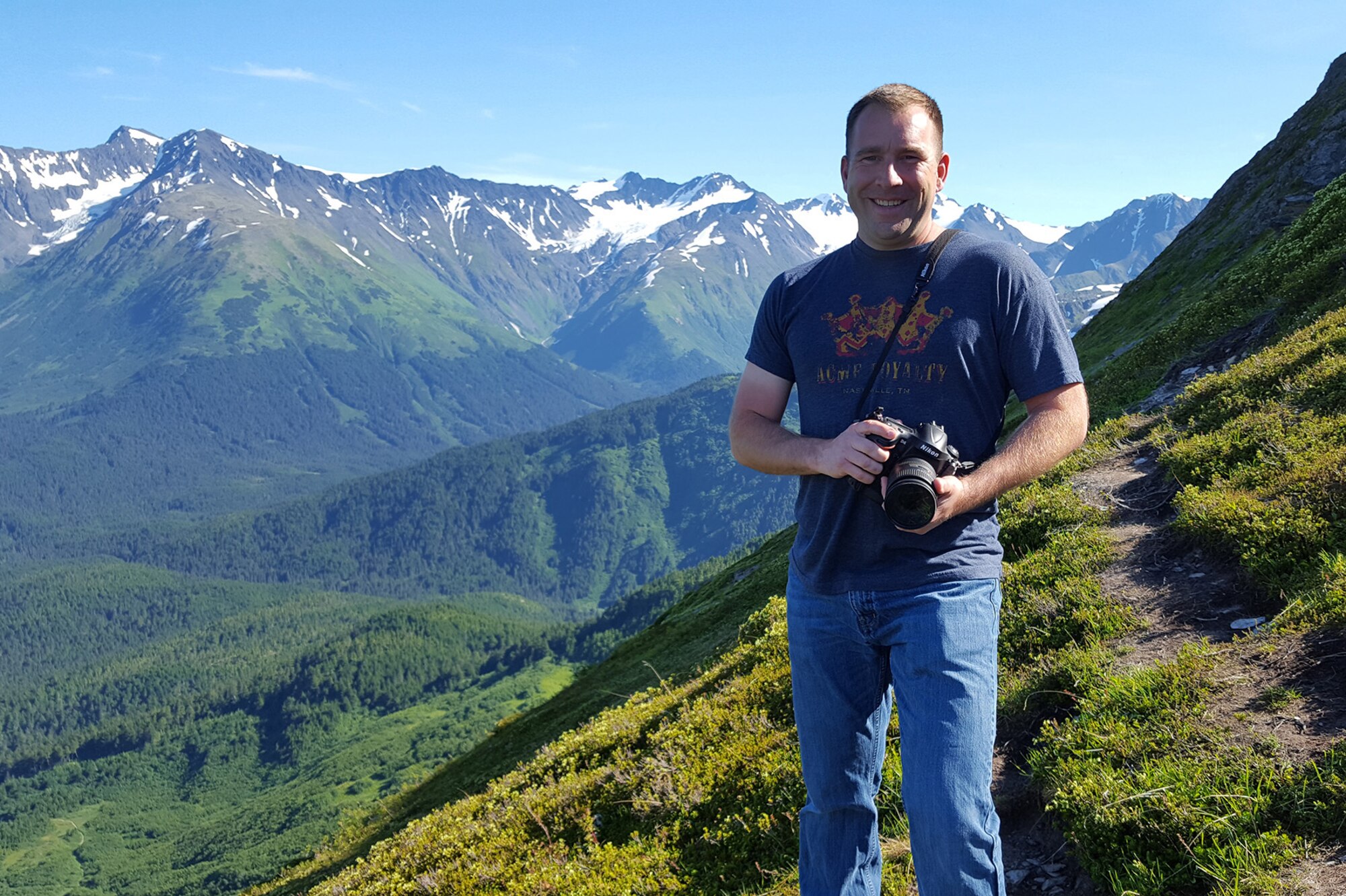 Master Sgt. Jerry Harlan, a photojournalist assigned to the I.G. Brown Training and Education Center, photographs landscapes, July 16, 2016, in Alyeska, Alaska. (U.S. Air National Guard photo by Tech. Sgt. Erik Gallion)