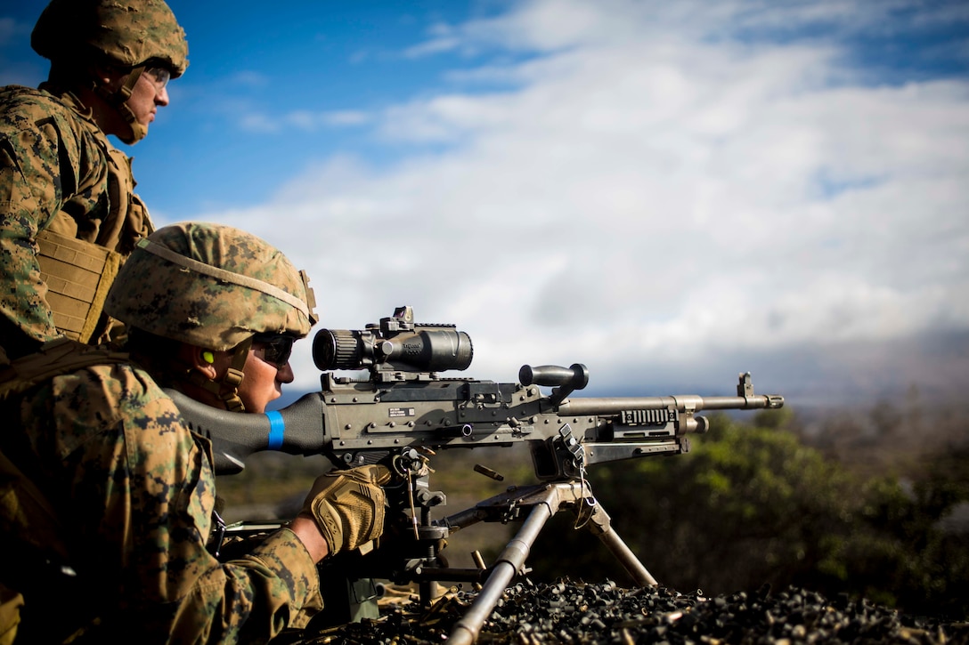 Lance Cpl. Jake Sherack (Top) and Pfc. Guadeloupe Campos (Bottom) sharpen their warfighting skills using an M240G machine gun at Pohakuloa Training Area, Hawaii, July 22, 2016. These Marines are participating in Rim of the Pacific 2016, a multinational military exercise, from June 29 to Aug. 8 in and around the Hawaiian Islands. RIMPAC helps integrate joint and combined capabilities to conduct amphibious, offensive, defensive, and stability operations. Sherack, a native of Medford, New York, and Campos, a native of Houston, are both machine gunners with Golf Company, 2nd Battalion, 3rd Marine Regiment, which supports III MEF Expeditionary Force.