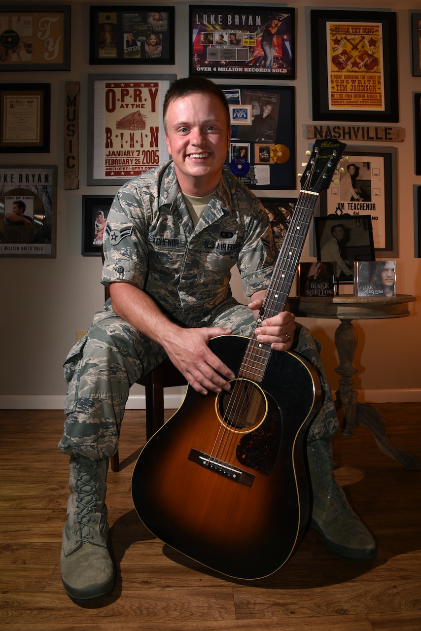 Airman 1st Class Jamie Teachenor, U.S. Air Force Academy Band and Wild Blue Country lead vocalist, displays his gold and platinum records in his home at Peterson Air Force Base, Colo., on July 20, 2016. Teachenor wrote numerous chart-topping songs for some of the most recognizable names in the country music world, including Blake Shelton, Vince Gill, Luke Bryan, Trace Adkins, Montgomery Gentry, Trisha Yearwood, Gretchen Wilson, Blaine Larsen and many more. (U.S. Air Force photo by Airman 1st Class Dennis Hoffman)