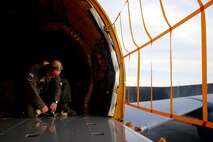 A U.S. Air Force boom operator for the 909th Air Refueling Squadron fastens harnesses inside in preparation for a training flight inside a KC-135R Stratotanker June 21, 2016, at Kadena Air Base Japan. Kadena is home to 15 KC-135R Stratotankers, which have been the Air Force’s core aerial refueling asset for more than 50 years. (U.S Air Force photo by Senior Airman John Linzmeier)