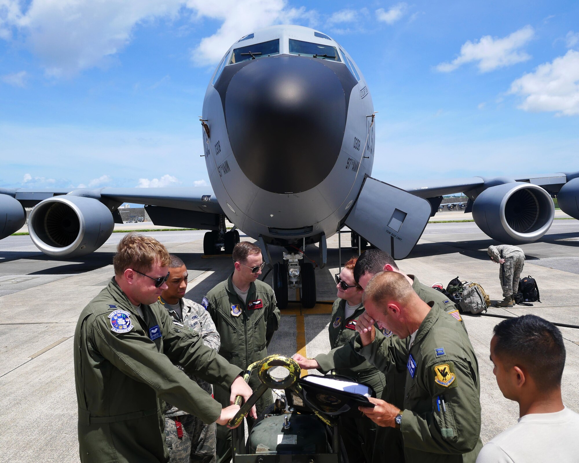 Aircrew members from the 909th Air Refueling Squadron conduct a preflight briefing for a training flight June 30, 2016, at Kadena Air Base Japan. The 909th ARS provides combat-ready KC-135s and aircrews to support peacetime operations and all levels of conflict in the Indo-Asia-Pacific region. (U.S. Air Force photo by Senior Airman John Linzmeier)