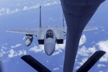 An F-15 Eagle from the 44th Fighter Squadron approaches the boom of a KC-135R Stratotanker from the 909th Air Refueling Squadron June 30, 2016, near Okinawa, Japan. The 909th recently entered its 45th year of providing air-to-air refueling to U.S. and allied aircraft. (U.S. Air Force photo by Senior Airman John Linzmeier)