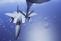An F-15 Eagle from the 44th Fighter Squadron prepares to receive fuel from the boom of a KC-135R Stratotanker from the 909th Air Refueling Squadron June 30, 2016, near Okinawa, Japan. The KC-135 provides the core aerial refueling capability for the United States Air Force and has excelled in this role for more than 50 years working to accomplish its primary mission of global reach. (U.S. Air Force photo by Senior Airman John Linzmeier)