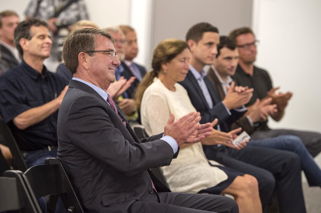 Defense Secretary Ash Carter and audience members applaud following remarks during an announcement at the new Defense Innovation Unit Experimental, or DIUx,  office in Boston,  July 26, 2016. DoD photo by Air Force Tech. Sgt. Brigitte N. Brantley