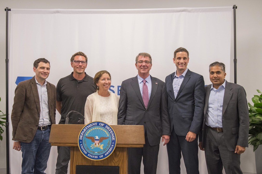 Defense Secretary Ash Carter, center right, poses for a photograph with speakers after a meeting at the new Defense Innovation Unit Experimental, or DIUx,  office in Boston, July 26, 2016. DoD photo by Air Force Tech. Sgt. Brigitte N. Brantley
