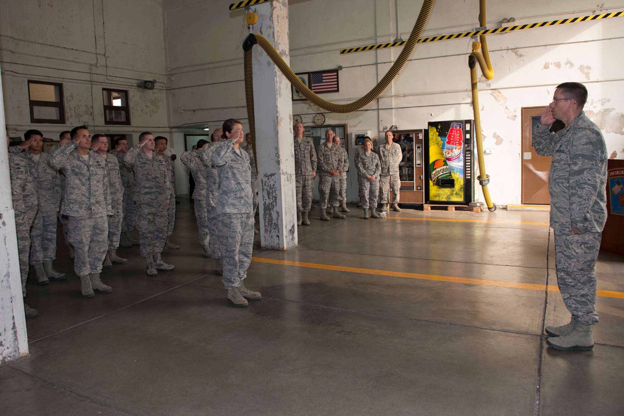 U.S. Air Force Maj. Myles Gilbert, 39th Civil Engineer Squadron (CES) commander, renders his first salute to 39th CES Airmen during a change of command ceremony July 18, 2016, at Incirlik Air Base, Turkey. Gilbert led a 294 member flight that supported 47 host and tenant units at Holloman Air Force Base, New Mexico. (U.S. Air Force photo by Senior Airman John Nieves Camacho)