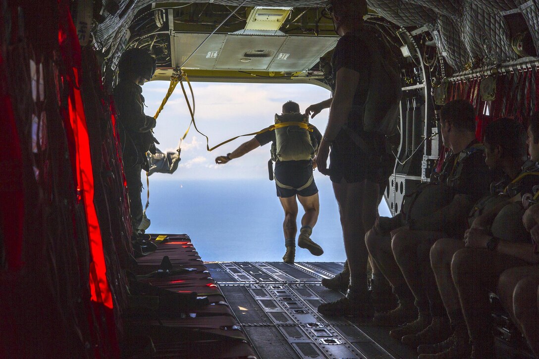 Army Rangers parachute from a CH-47F Chinook helicopter during a water insertion off the coast of Tybee Island, Ga., July 20, 2016. Army photo by Spc. Scott Lindblom