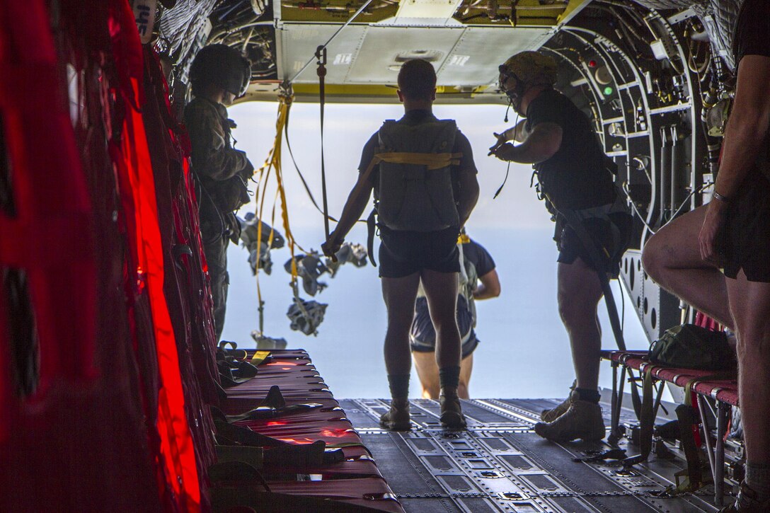Army Rangers parachute from a CH-47F Chinook helicopter during a water insertion off the coast of Tybee Island, Ga., July 20, 2016. Army photo by Spc. Scott Lindblom