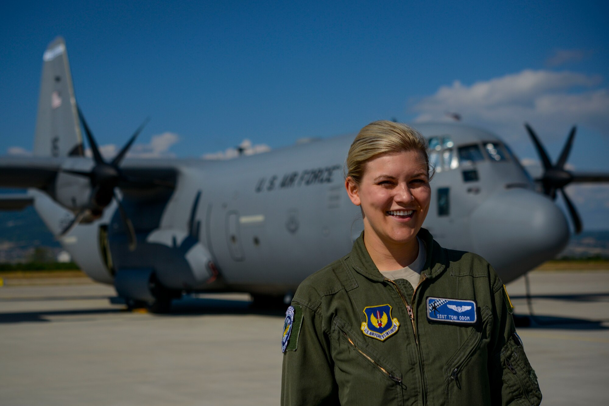 Staff Sgt. Toni Odom, 37th Airlift Squadron loadmaster and Thracian Summer 2016 ramp coordinator, stands in front of a C-130J Super Hercules July 21, 2016, at Plovdiv Airport, Bulgaria. Odom was one of two ramp coordinators for Thracian Summer 2016, where she was in charge of 26 personnel for the two-week forward training deployment. (U.S. Air Force photo/Senior Airman Nicole Keim) 