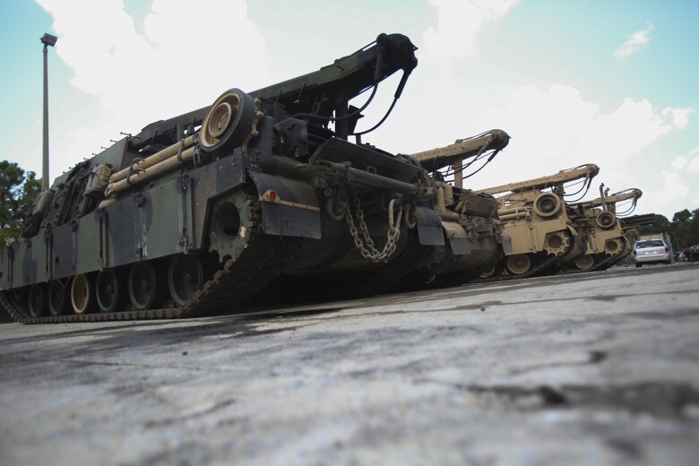 M88 Recovery Vehicles are lined up prior to being moved onto the floor for repairs at 2nd Maintenance Battalion at Camp Lejeune, N.C., July 21, 2016. 2nd Maint. Bn. received the Chesty Puller Award, the Ground Safety Award and the Department of Defense Maintenance Award for the Marines ability to keep up with their work and complete their mission.(U.S. Marine Corps photo by Lance Cpl. Miranda Faughn/Released)