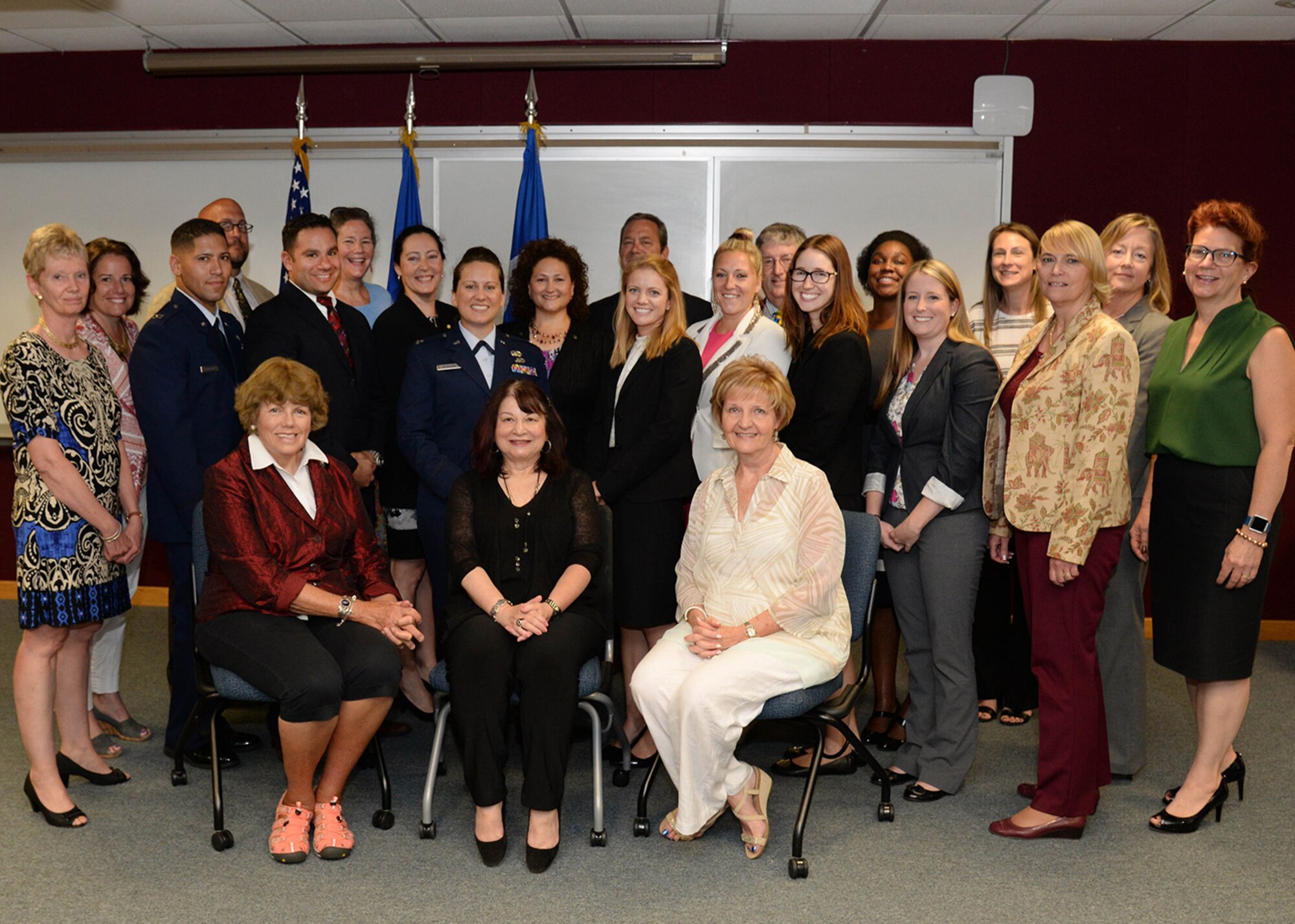 Hanscom program manager seminar students, University of Massachusetts Lowell representatives and MassDevelopment leadership pause for a group photo following a certificate presentation ceremony held at the Hanscom Education and Training Center July 26. The Hanscom students successfully completed the six-part seminar, which was part of an Education Partnership Agreement between Hanscom and UMass Lowell. (U.S. Air Force photo by Linda LaBonte Britt)