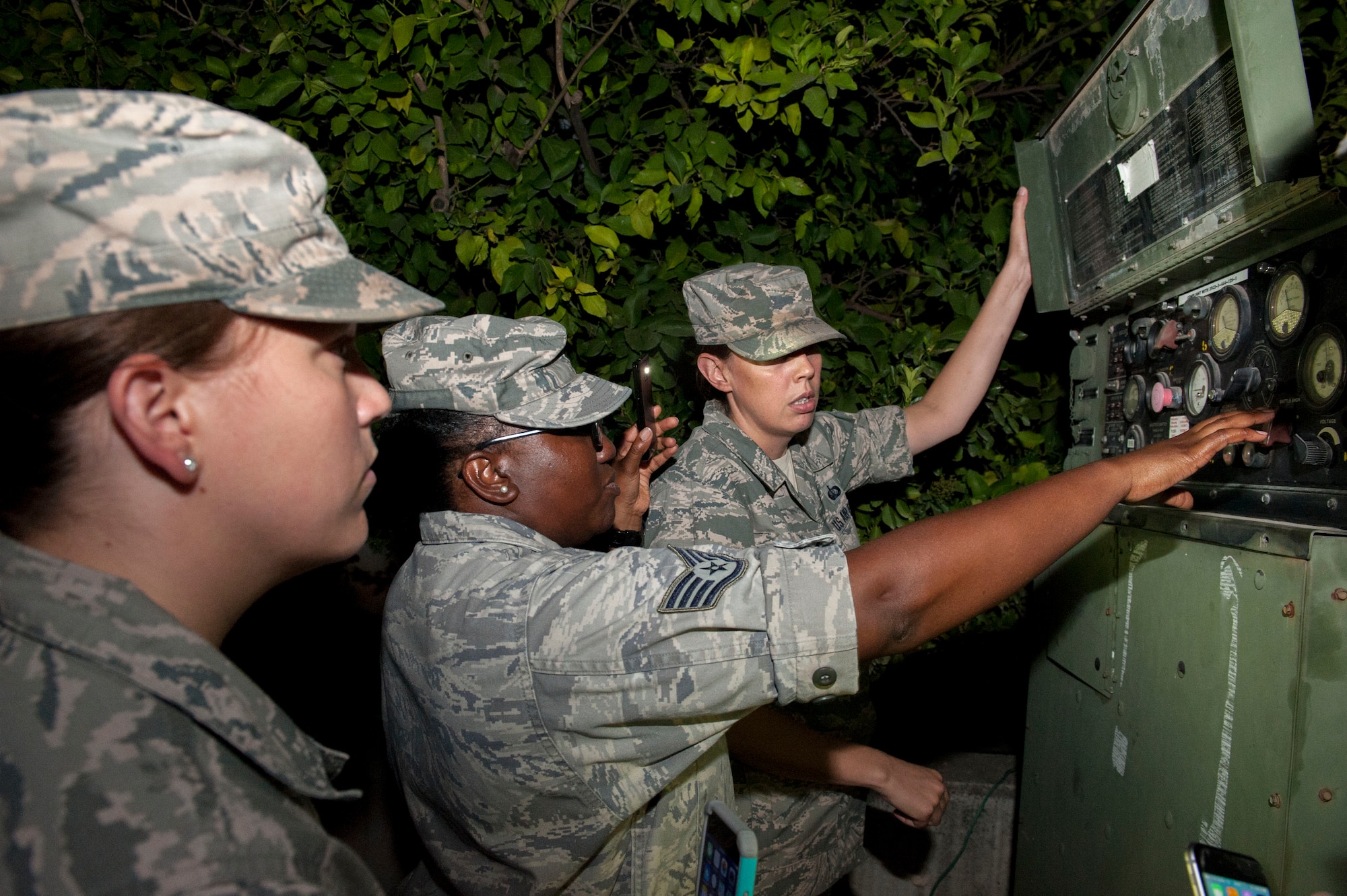 Airmen from the 39th Force Support Squadron check the fuel and energy status of a power generator keeping refrigerators running July 20, 2016, at Incirlik Air Base, Turkey. Due to an extended loss of commercial power to the base, facilities were required to run on internal generated power to sustain operations. (U.S. Air Force photo by Staff Sgt. Jack Sanders)