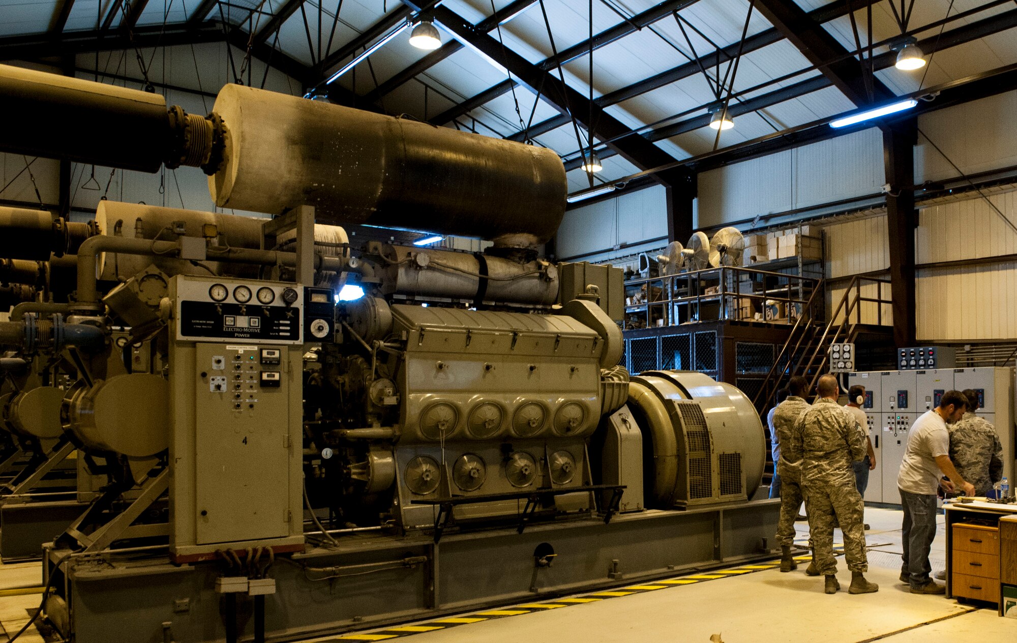 Members of the 39th Civil Engineer Squadron check the status of generators July 20, 2016, at Incirlik Air Base, Turkey. Due to an extended loss of commercial power to the base, facilities were required to run on internal generated power to sustain operations. (U.S. Air Force photo by Staff Sgt. Jack Sanders)