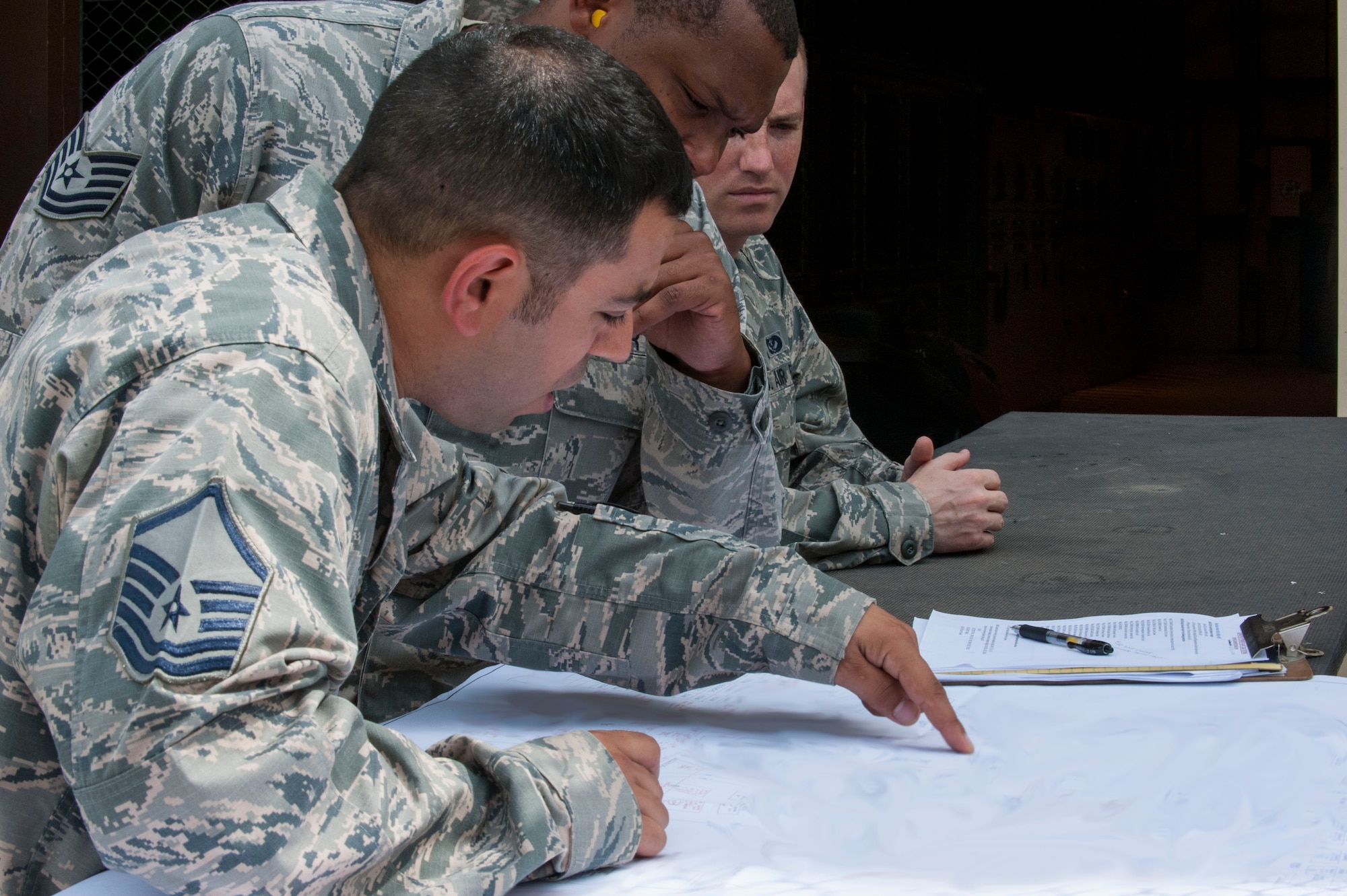 U.S. Air Force Master Sgt. Shawn Slaiman, 39th Civil Engineer Squadron installation management flight chief, discusses facilities being powered by generators July 20, 2016, at Incirlik Air Base, Turkey. Due to an extended loss of commercial power to the base, facilities were required to run on internal generated power to sustain operations. (U.S. Air Force photo by Staff Sgt. Jack Sanders)