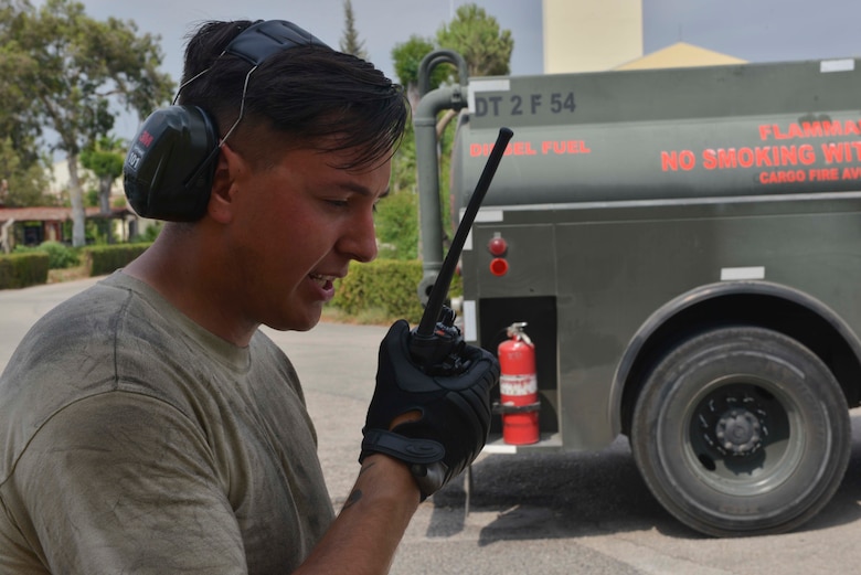 U.S. Air Force Airman 1st Class Trenton Beard, 39th Logistics Readiness Squadron fuels specialist, communicates through a land-mobile radio July 19, 2016, at Incirlik Air Base, Turkey. Radios are used to transmit messages between separated personnel across a network. (U.S. Air Force photo by Senior Airman John Nieves Camacho)