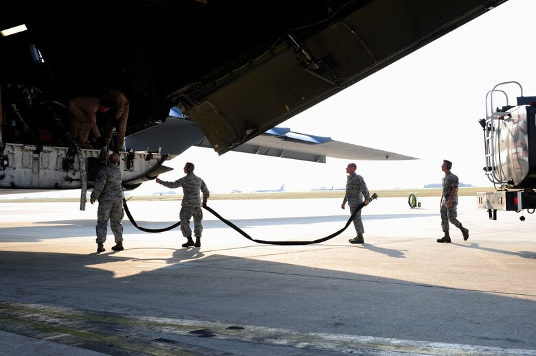 Airmen from the 39th Logistics Readiness Squadron, download fuel from a U.S. Air Force C-5M Super Galaxy July 22, 2016, at Incirlik Air Base, Turkey. Due to an extended loss of commercial power to the base, supplies, including food, water and fuel were delivered to sustain missions here at Incirlik. (U.S. Air Force photo by Airman 1st Class Devin M. Rumbaugh)