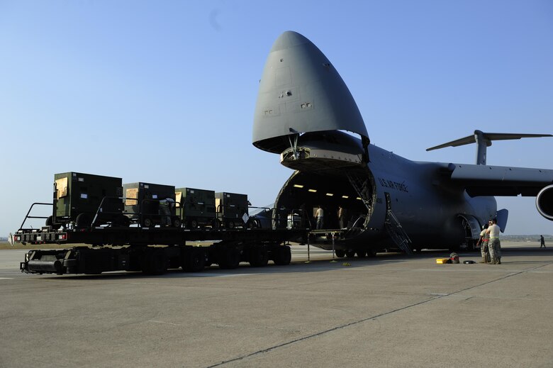 Airmen assigned to the 39th Air Base Wing, unload generators off of a U.S. Air Force C-5M Super Galaxy July 22, 2016, at Incirlik Air Base, Turkey. Due to an extended loss of commercial power to the base, supplies, including food, water and fuel were delivered to sustain missions here at Incirlik. (U.S. Air Force photo by Airman 1st Class Devin M. Rumbaugh)