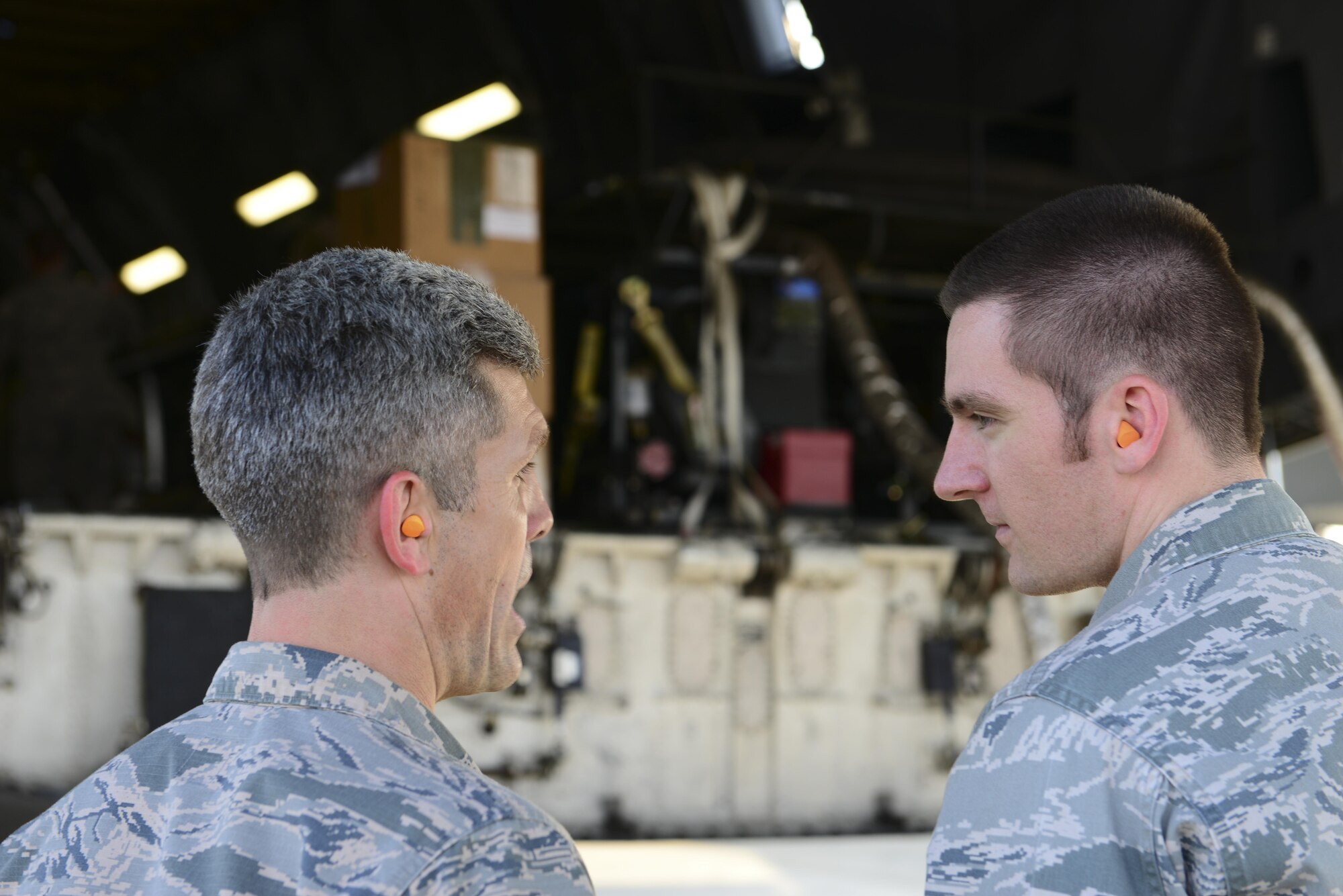 U.S. Air Force Lt. Col. Nathan Mansfield, 728th Air Mobility Squadron commander, speaks with Capt. Brian Jorgensen, 39th Logistics Readiness Squadron operations officer, about the aerial bulk fuel delivery system aboard a C-5M Super Galaxy July 22, 2016, at Incirlik Air Base, Turkey. The fuel system can hold up to 3,000 gallons of fuel. (U.S. Air Force photo by Tech. Sgt. Caleb Pierce)