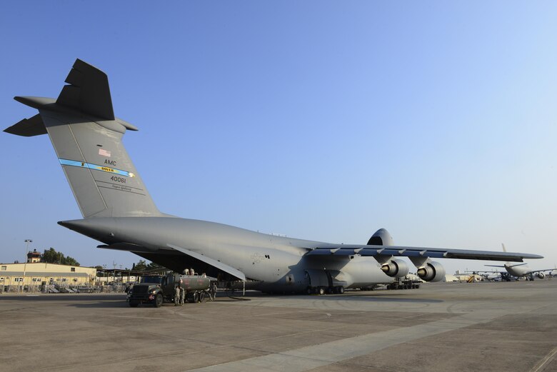 Fuel and supplies are unloaded from a U.S. Air Force C-5M Super Galaxy July 22, 2016, at Incirlik Air Base, Turkey. Due to an extended loss of commercial power, food, fuel and other supplies were sent to Incirlik to sustain missions here at Incirlik. (U.S. Air Force photo by Tech. Sgt. Caleb Pierce) 