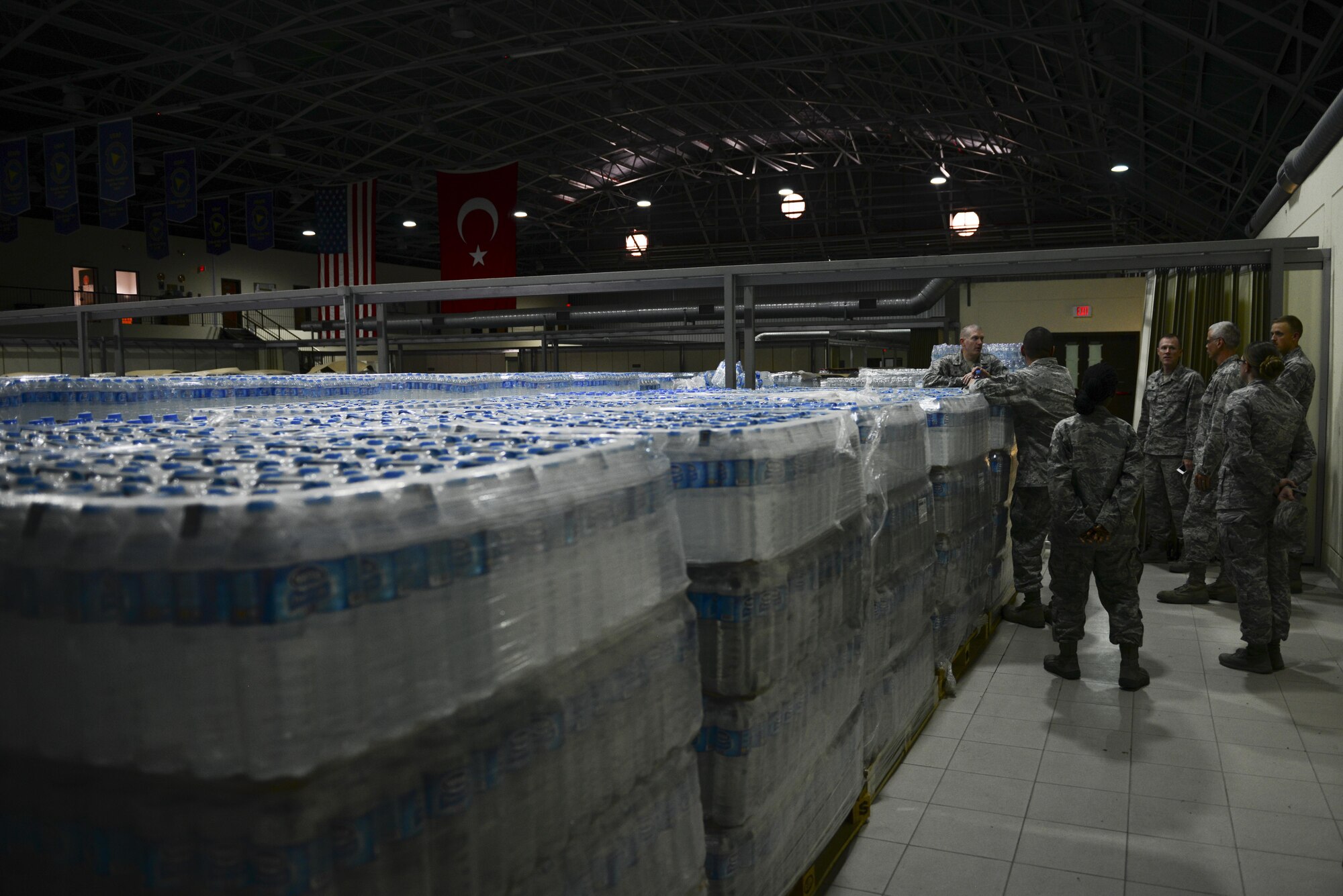 U.S. Air Force Col. John Walker, 39th Air Base Wing commander, meets with 39th Logistics Readiness Squadron Airmen during a site survey July 23, 2016, at Incirlik Air Base, Turkey. Walker visited multiple sites to check on supplies received during a recent commercial power loss. (U.S. Air Force photo by Tech. Sgt. Caleb Pierce) 