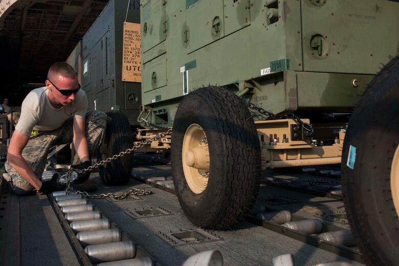 U.S. Air Force Senior Airman Kevin Paquin, 728th Air Mobility Squadron air transportation journeyman, secures a generator for transport July 22, 2016, at Incirlik Air Base Turkey. The generators were used to supply power to base facilities. (U.S. Air Force photo by Senior Airman John Nieves Camacho)