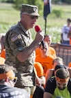 Lt. Col. Matt Lawrence, Chief of Recruiting Communications for the Office of the Chief of the Army Reserve, motivates the crowds of participants of this year's Twin Cities Tough Mudder in Hugo, MN. The Army Reserve has sponsored ten Tough Mudder events across the United States in order to bring more awareness about the Army Reserve to the community. (U.S. Army photo by Staff Sgt. Cliff Coy)